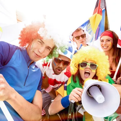 Enthusiastic Fans Cheer With Flags And Megaphone 2026 03 09 03 24 22 Utc