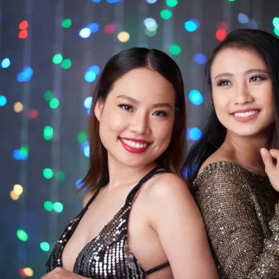 Two Smiling Women Posing In Evening Attire 2026 03 18 14 53 46 Utc