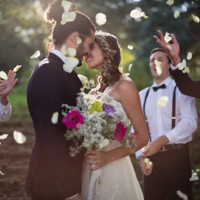 Couple Kissing On Wedding Day With Flower Petals 2026 01 09 09 38 11 Utc