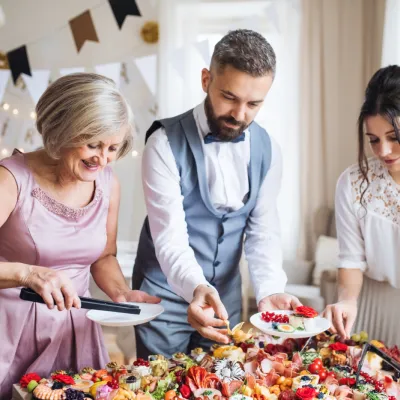 Festive Buffet Table With Guests Serving Themselve 2026 03 10 03 11 40 Utc